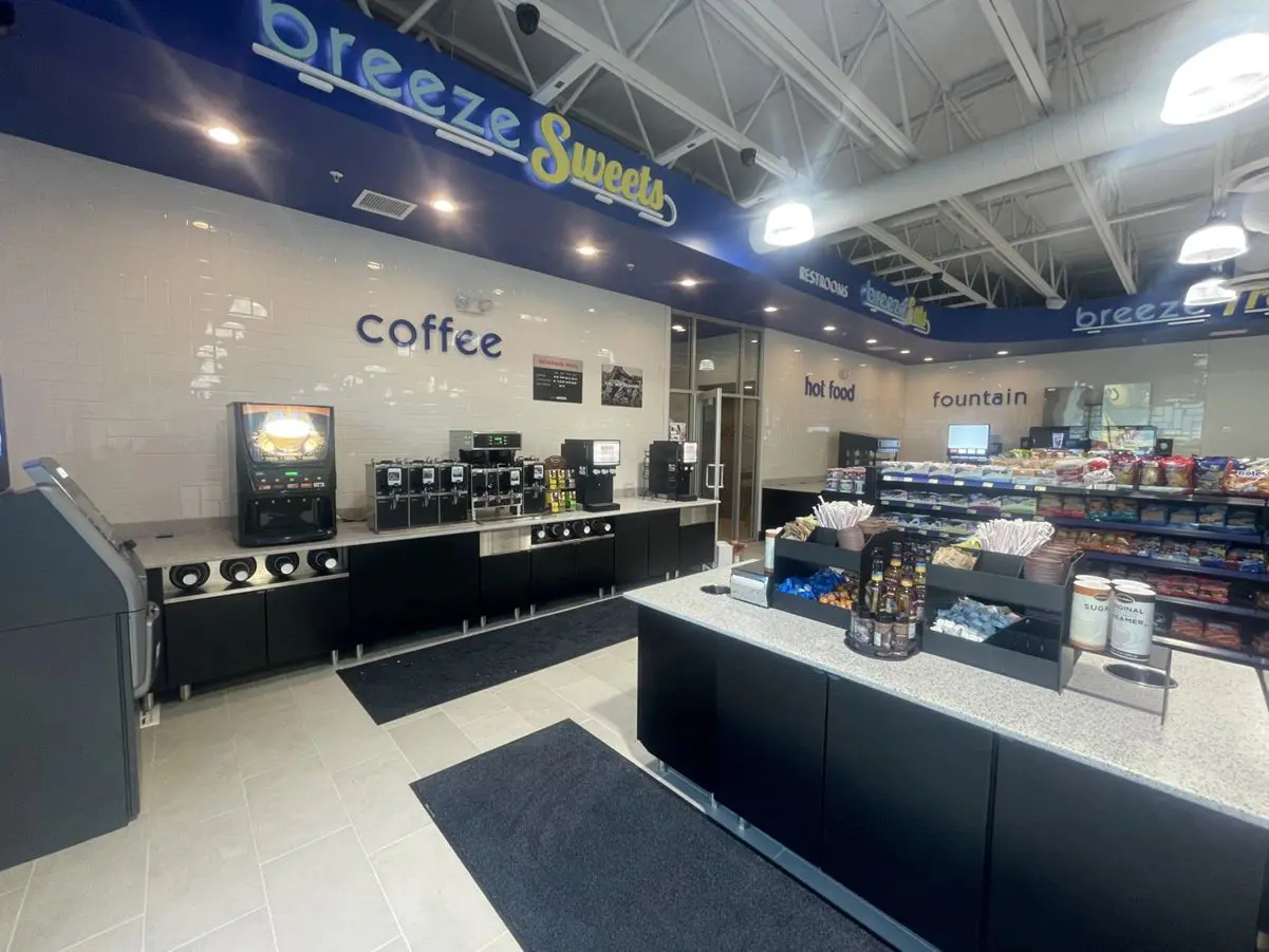Convenience store interior with coffee and snacks.